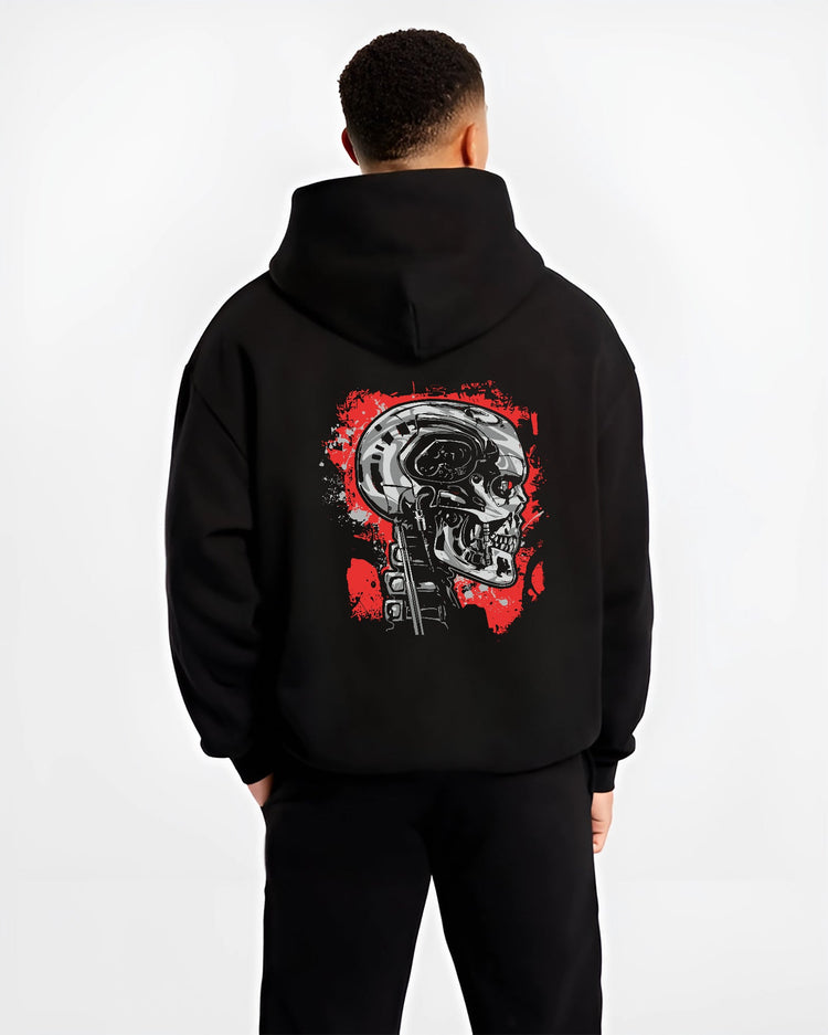Black hoodie on male model, back view, featuring Terminator T-800 cyberpunk skull artwork in retro sci-fi film style.