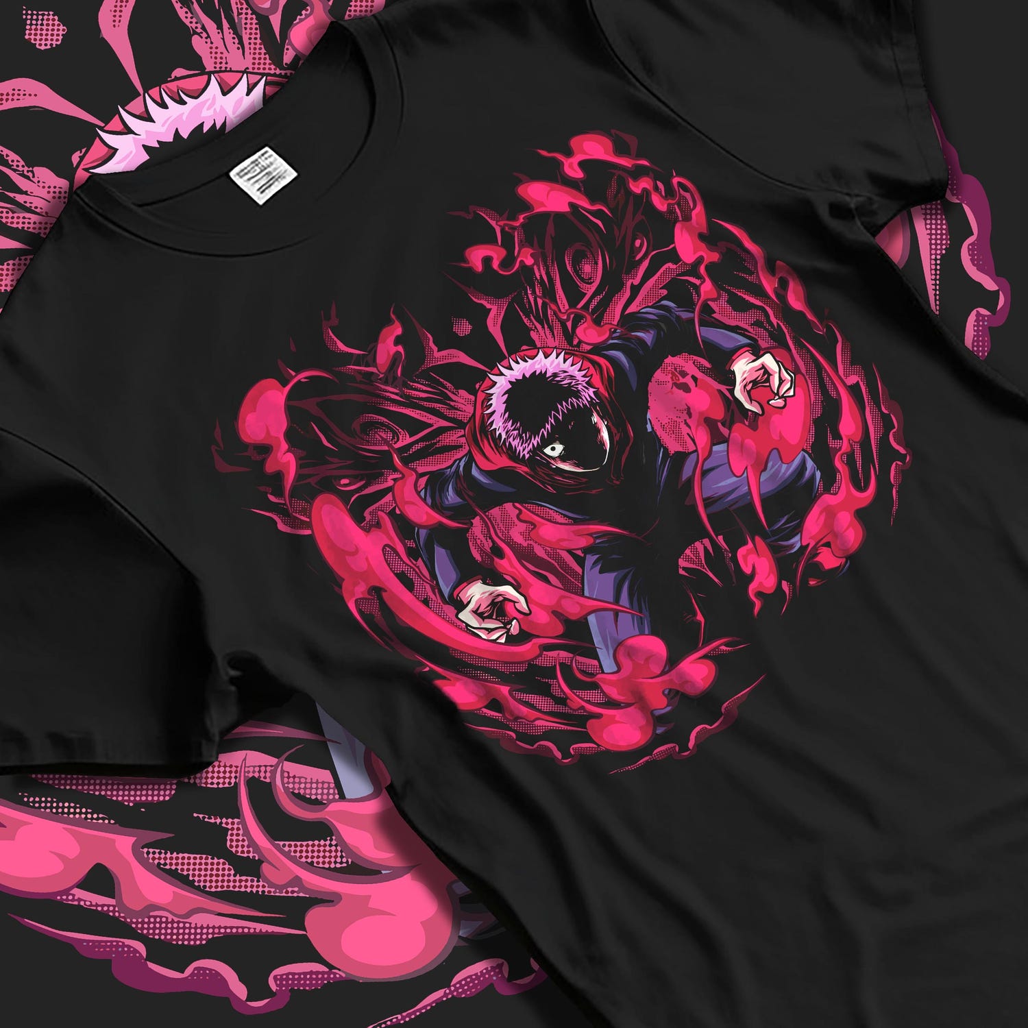 Black T-shirt laid flat with soft folds, featuring Yuji Itadori dark manga artwork surrounded by crackling red cursed energy.