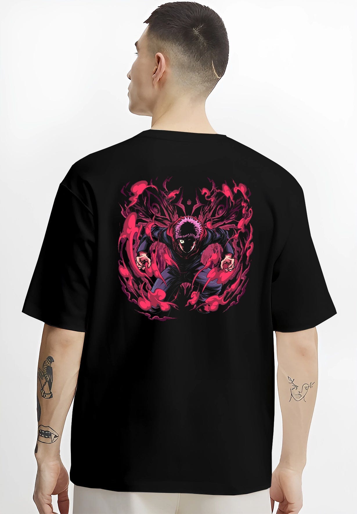 Black T-shirt on male model, back view, Yuji Itadori Jujutsu Kaisen battle graphic with vivid red cursed energy effects.