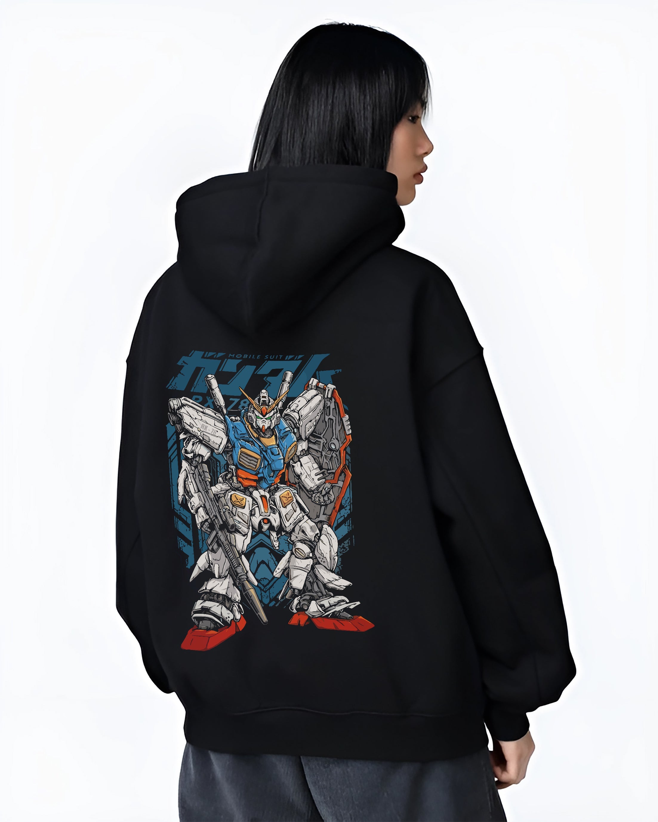 Black hoodie worn by a female model, back view, featuring Zeta Gundam retro manga mecha artwork styled like vintage Japanese animation poster inspired streetwear